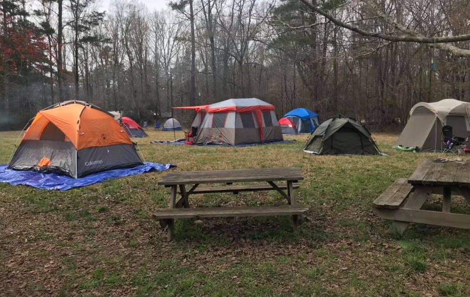  Several tents are set up in a field at Camp Wistagoman 