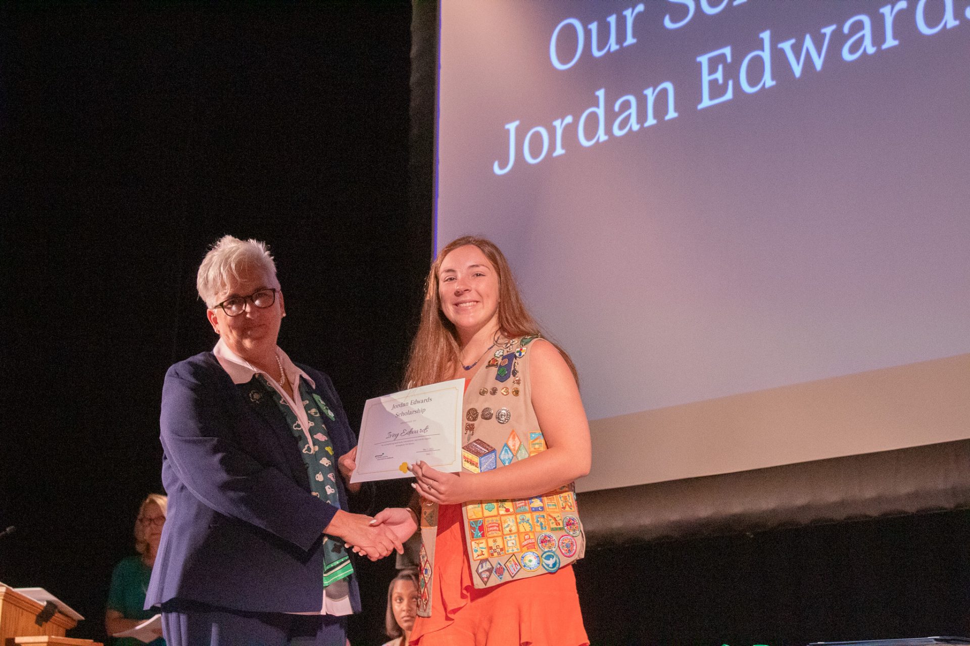 CEO Lora shakes hands with the Jordan/Edwards Scholarship recipient