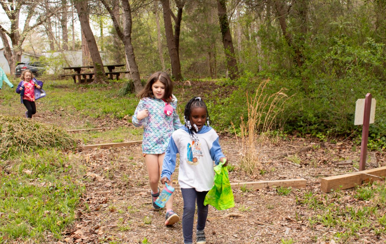 two campers run down outdoor steps