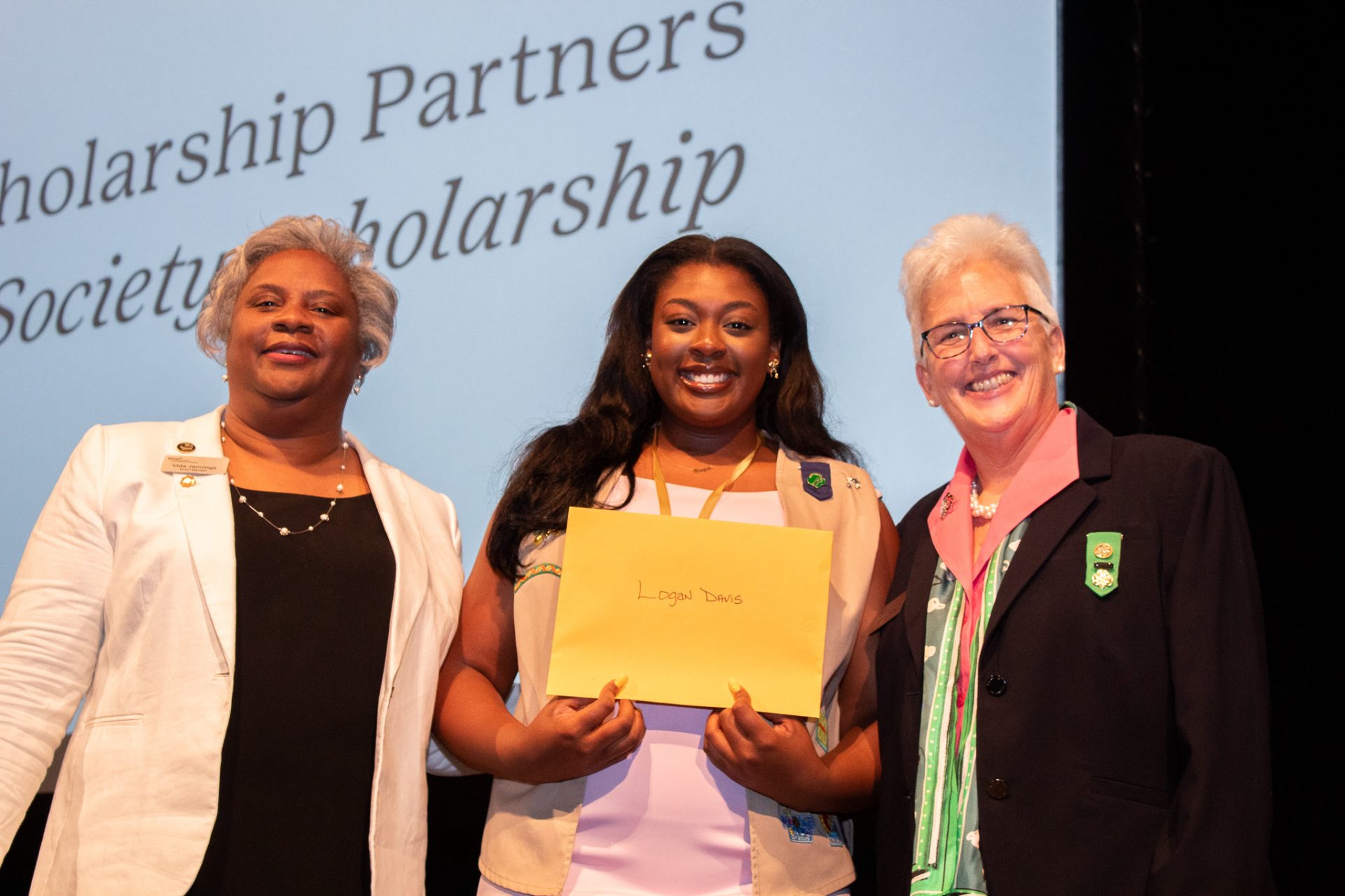 Frances Griggs, board chair, poses with the Trefoil Society Scholarship recipient