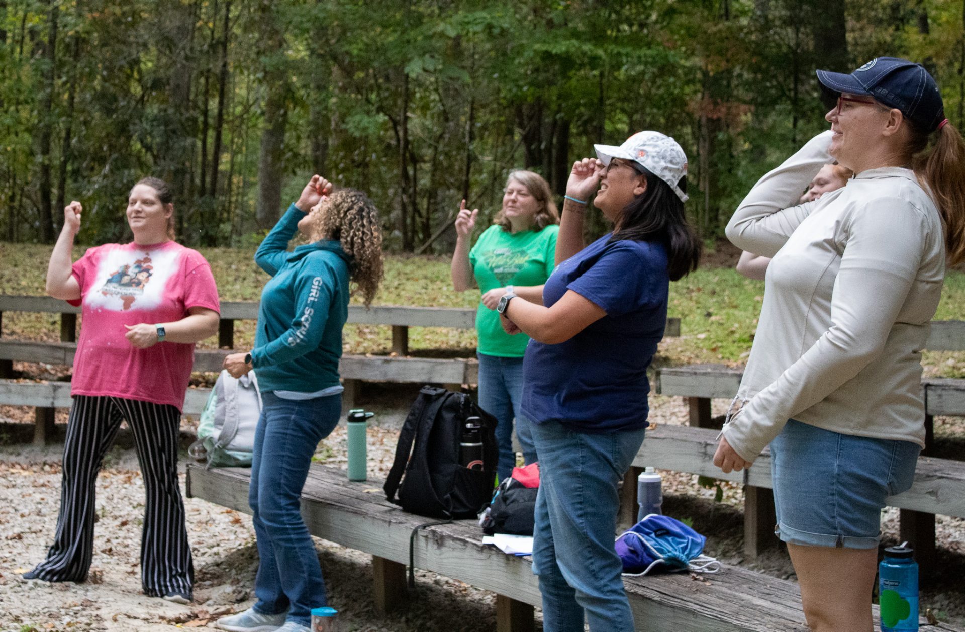  Volunteers learn a camp cheer at Mountain Magic, a volunteer learning event. 