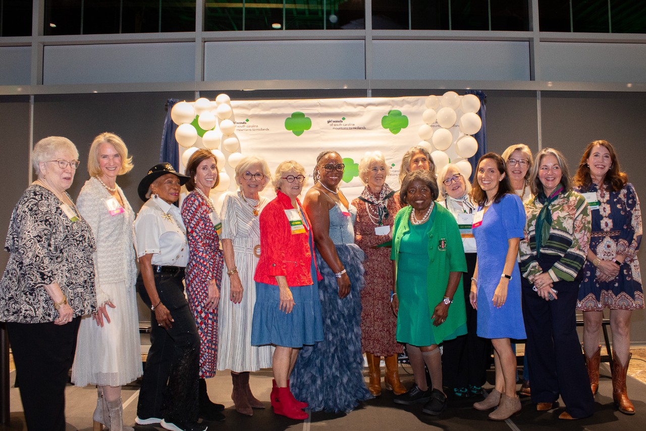 two honorees pose with Board Chair Kavita Borsum and COO Lynn Arve